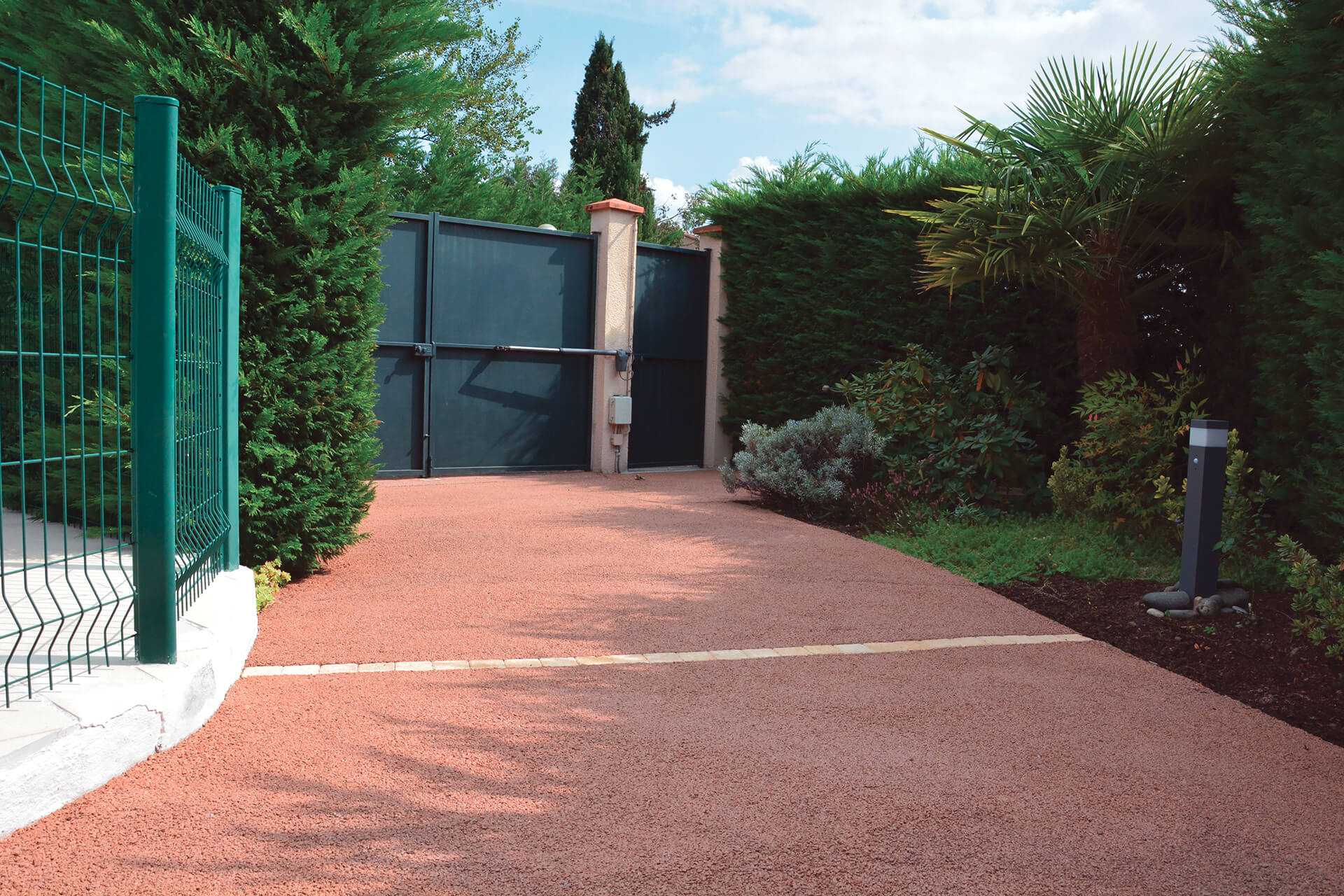 allée de garage béton drainant — réalisation Inspiration Résine