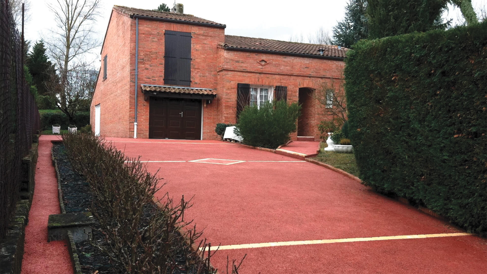 allée de garage béton drainant — réalisation Inspiration Résine